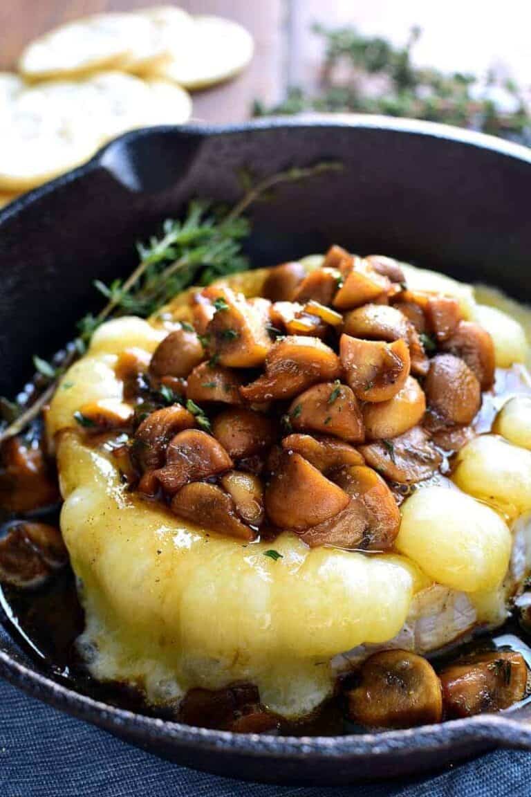 Mushroom Marsala Baked Brie combines rich marsala-glazed mushrooms with creamy baked brie in a delicious appetizer that's perfect for New Years Eve or anytime!