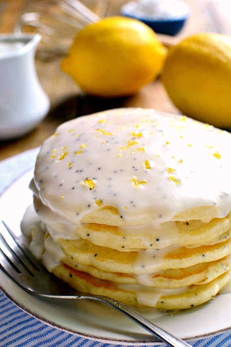 Lemon Poppy Seed Pancakes are light, fluffy, and bursting with lemon flavor! Easy breakfast pancakes to start your day off right. Try them with lemon poppy seed glaze for a sweet, tart, delicious start to your day.