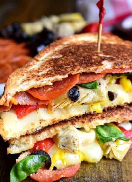 Italian Antipasto Grilled Cheese Sandwiches are a delicious twist on grilled cheese. These hot sandwiches are loaded with pepperoni, cheese, artichokes, olives, and roasted red peppers!