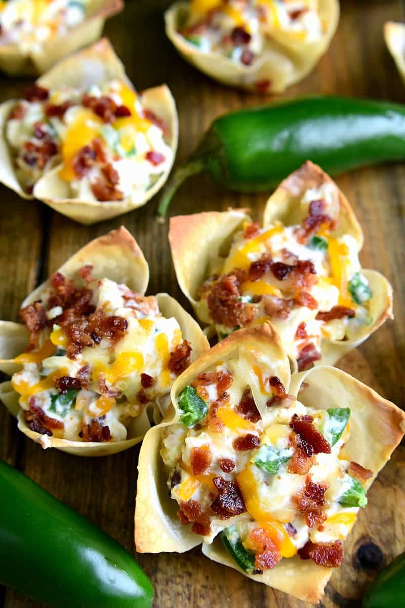 These JalapeÃ±o Popper Wonton Cups are loaded with bacon, jalapeÃ±os, cream cheese, cheddar cheese, and sour cream....all in a crispy wonton shell! The perfect party or game day appetizer!