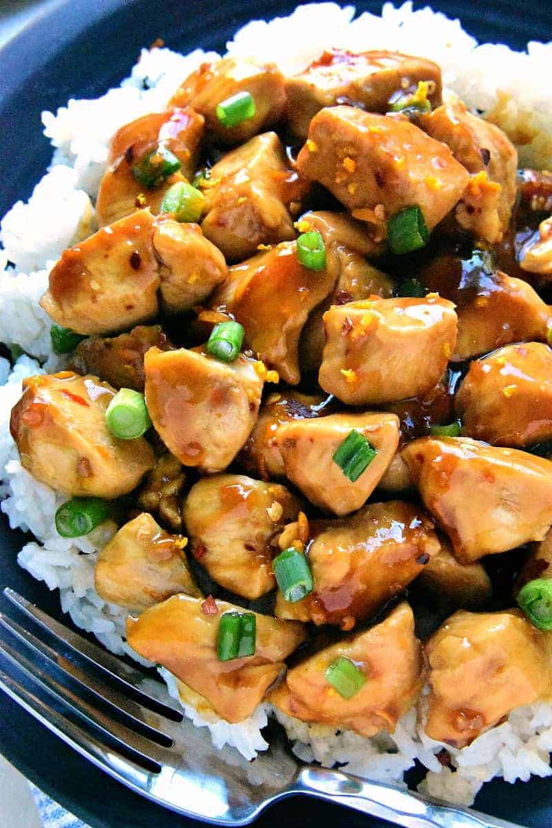 Skinny Orange Chicken - a delicious, lightened up version of your favorite takeout! This easy recipe comes together in 30 minutes or less and is guaranteed to satisfy the whole family!