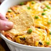 Southwest Buffalo Chicken Dip will put a southwest spin on a party favorite! This rich and creamy dip will have you craving more! It's gooey, cheesy, and loaded with delicious flavor.