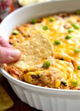 Southwest Buffalo Chicken Dip will put a southwest spin on a party favorite! This rich and creamy dip will have you craving more! It's gooey, cheesy, and loaded with delicious flavor.