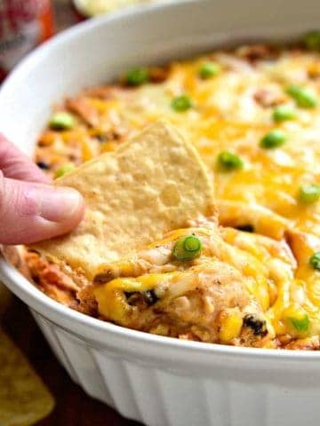 Southwest Buffalo Chicken Dip will put a southwest spin on a party favorite! This rich and creamy dip will have you craving more! It's gooey, cheesy, and loaded with delicious flavor.