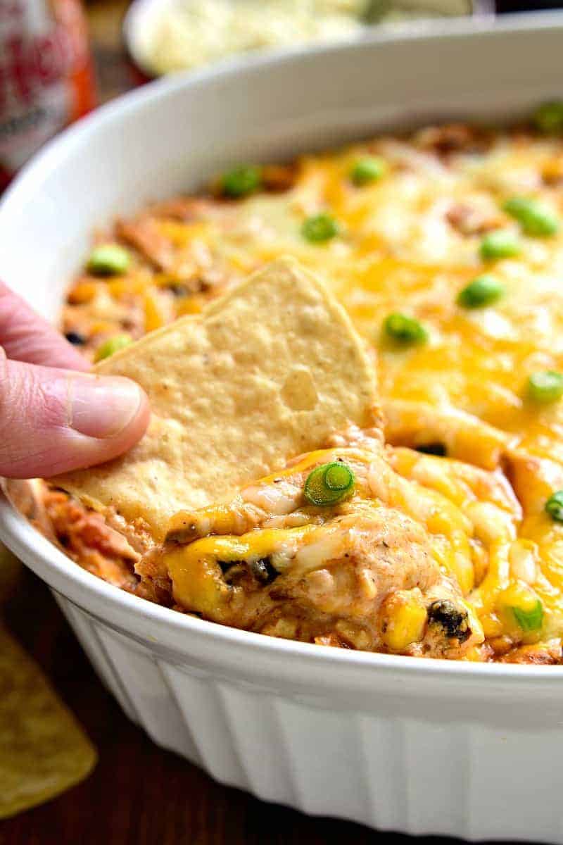 Southwest Buffalo Chicken Dip will put a southwest spin on a party favorite! This rich and creamy dip will have you craving more! It's gooey, cheesy, and loaded with delicious flavor.