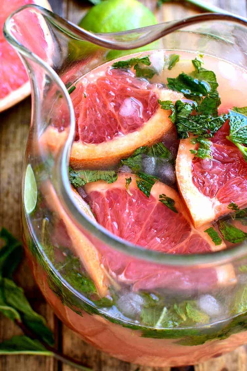 Grapefruit Mojitos are a delicious twist on a classic mojito. These easy mojitos combine grapefruit juice, lime juice, mint, and rum in a refreshing drink