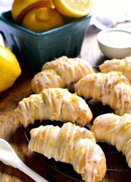 Lemon Cheesecake Crescent Rolls are bursting with bright lemon flavor! Flaky crescent rolls filled with creamy lemon cheesecake, topped with a citrus glaze...the perfect brunch recipe!