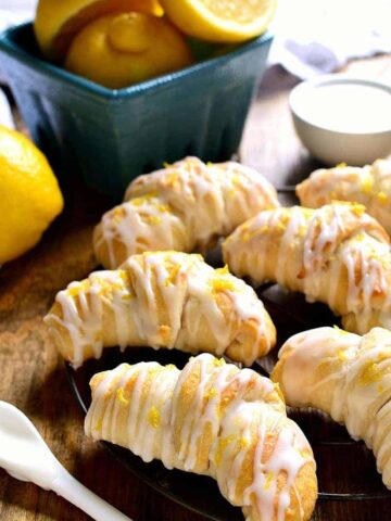 Lemon Cheesecake Crescent Rolls are bursting with bright lemon flavor! Flaky crescent rolls filled with creamy lemon cheesecake, topped with a citrus glaze...the perfect brunch recipe!