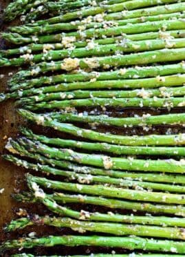 This Garlic Roasted Asparagus is packed with the delicious flavors of garlic and parmesan and is ready in 15 minutes or less!