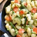 This Spring Vegetable Gnocchi is creamy, delicious, and comfort food at its finest. This gnocchi is loaded with fresh vegetables and comes together in under 20 minutes.