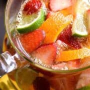 overhead image of a pitcher of skinny sangria with fresh fruit floating in it
