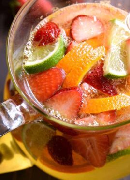 overhead image of a pitcher of skinny sangria with fresh fruit floating in it
