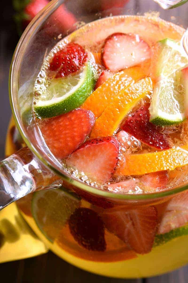 overhead image of a pitcher of skinny sangria with fresh fruit floating in it