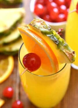 tropical mimosas garnished with fresh fruit