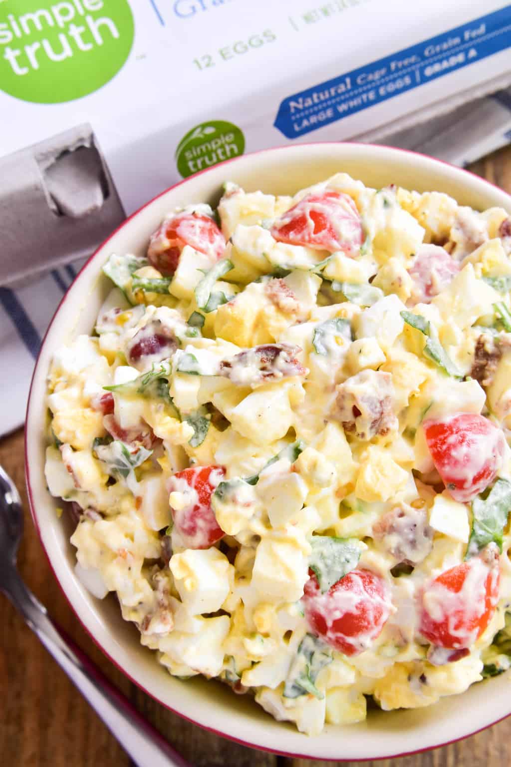 This BLT Egg Salad combines two classics in one delicious dish that's sure to become a new favorite! This egg salad has all the creamy deliciousness you expect from egg salad, plus the bold flavors of bacon, lettuce, and tomato. Perfect for weekday lunches and summer picnics, and a great way to use up leftover Easter eggs. If you love egg salad, you'll LOVE this yummy twist!