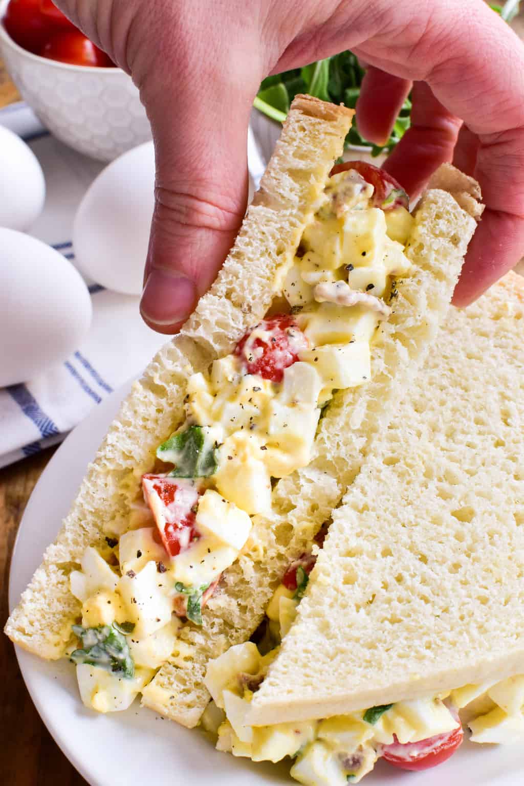 This BLT Egg Salad combines two classics in one delicious dish that's sure to become a new favorite! This egg salad has all the creamy deliciousness you expect from egg salad, plus the bold flavors of bacon, lettuce, and tomato. Perfect for weekday lunches and summer picnics, and a great way to use up leftover Easter eggs. If you love egg salad, you'll LOVE this yummy twist!
