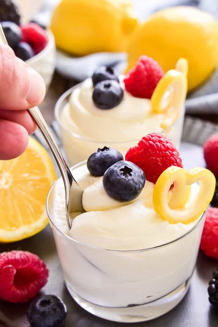 This easy Lemon Mousse is the perfect way to welcome spring! Light, fluffy mouse infused with the sweet flavor of lemon...this sweet treat is delicious all on its own or topped with fresh berries. Whether you're looking for a last minute Easter dessert or the perfect dessert for spring showers, this 5-ingredient Lemon Mousse is sure to be a hit!