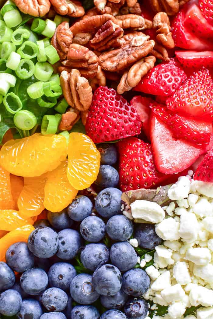 Take advantage of fresh berry season with this delicious Summer Strawberry Salad. Loaded with fresh strawberries, blueberries, mandarin oranges, pecans, goat cheese, and sparkling orange vinaigrette, this salad is the perfect balance of savory, sweet, crunchy, creamy, and YUMMY!