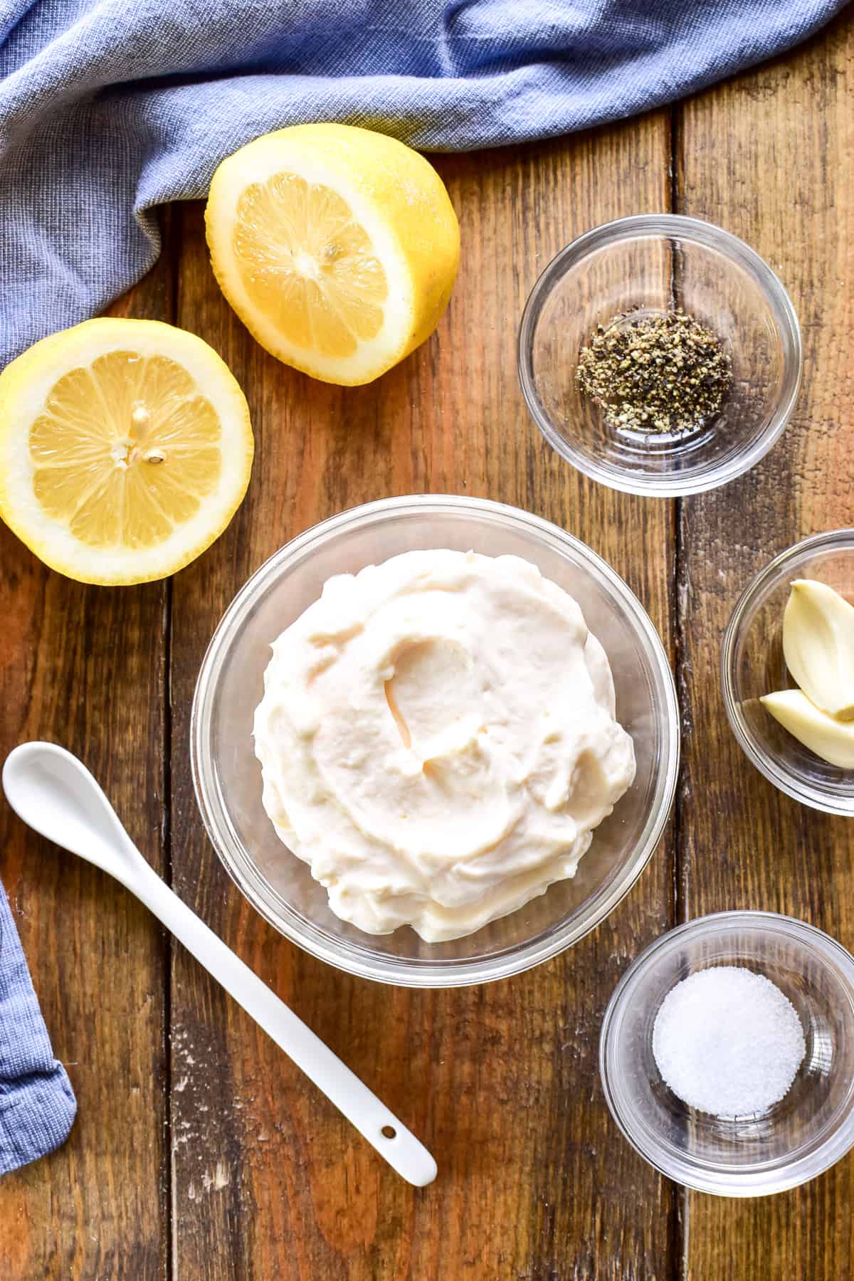 Garlic Aioli ingredients on a wooden table