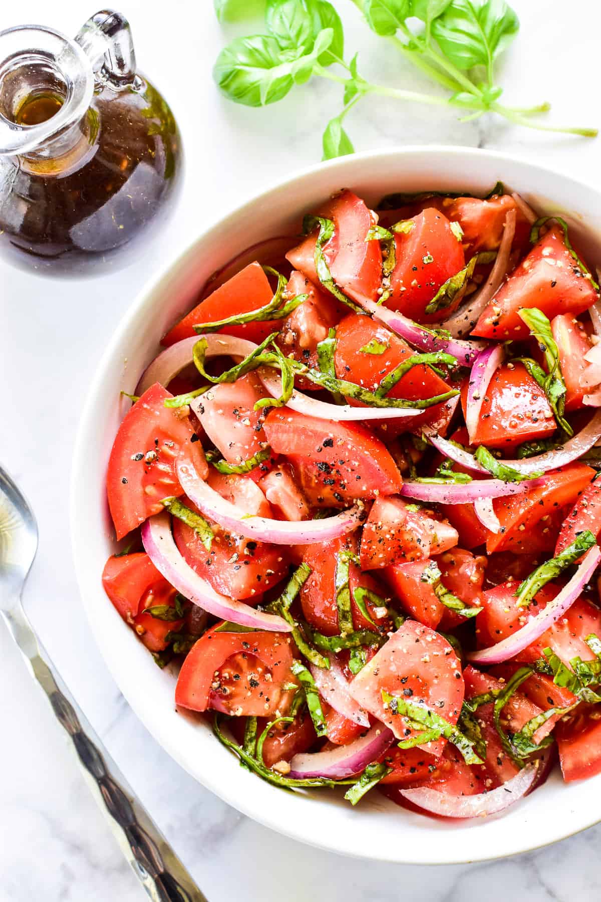 Overhead shot of Tomato Salad in a white bowl