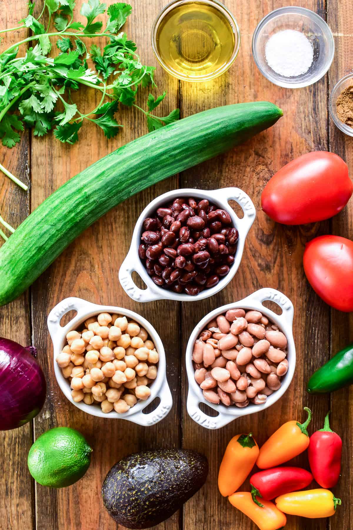 3 Bean Salad ingredients on a wooden board