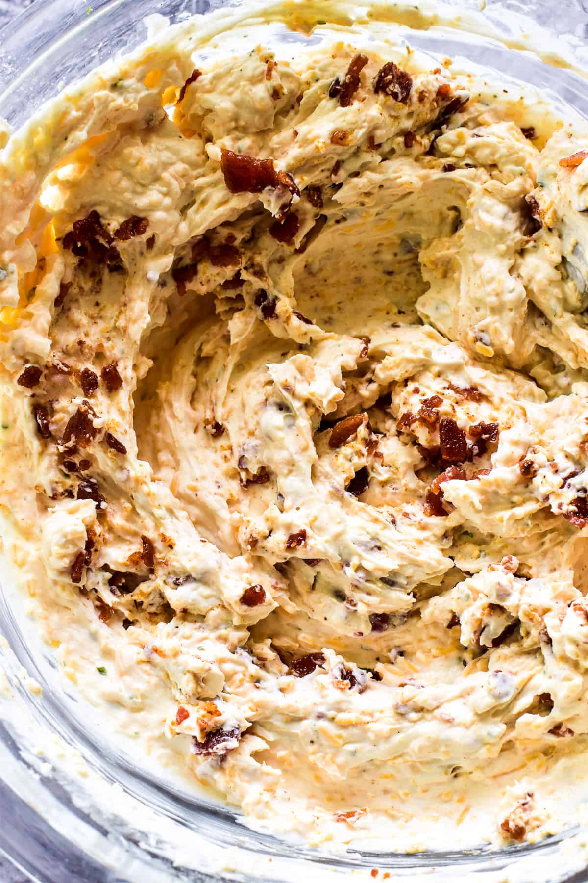 Creamy Bacon Beer Cheese Dip in a mixing bowl