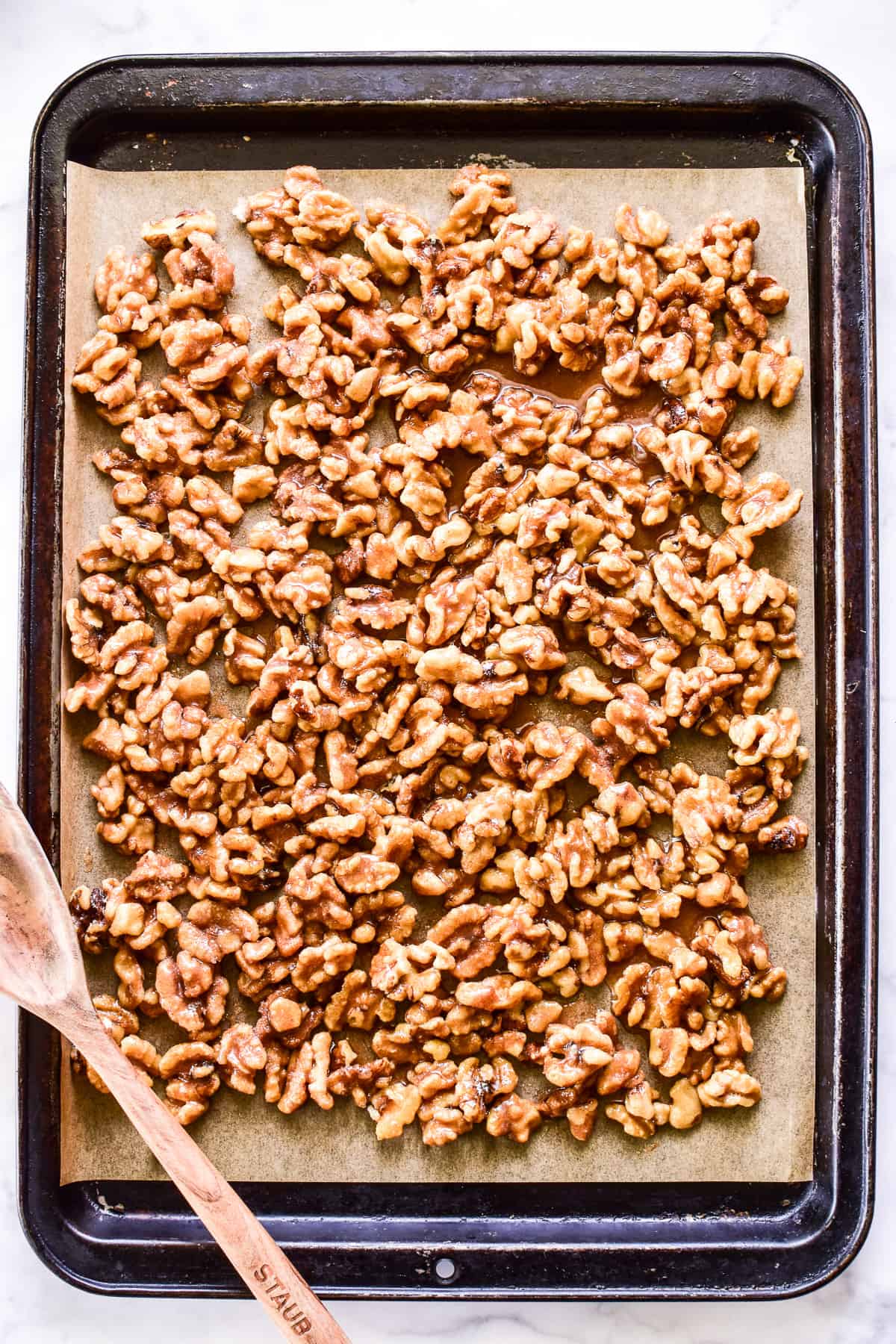 Overhead shot of Candied Walnuts on a baking pan