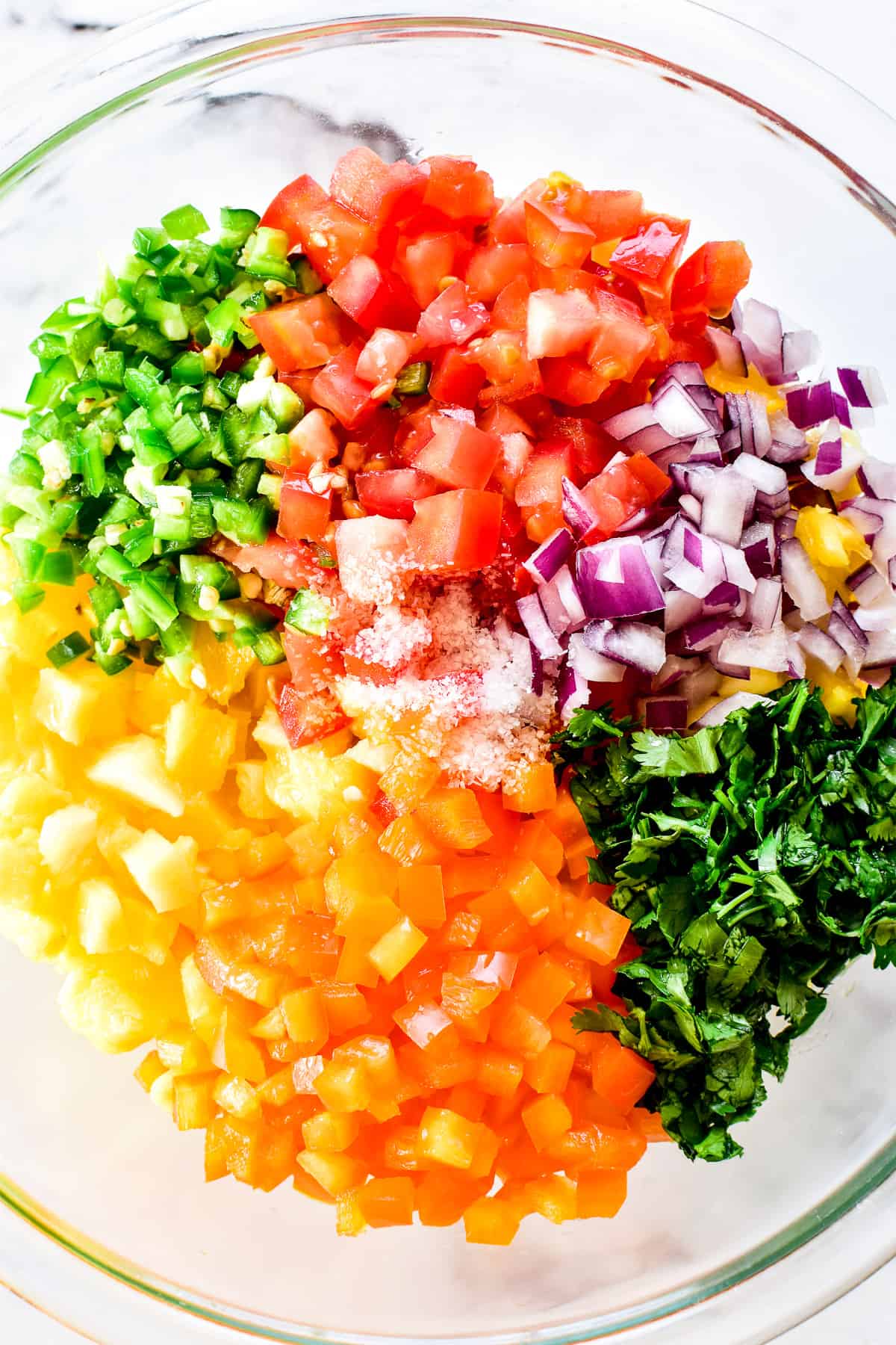 Pineapple Salsa ingredients layered in mixing bowl