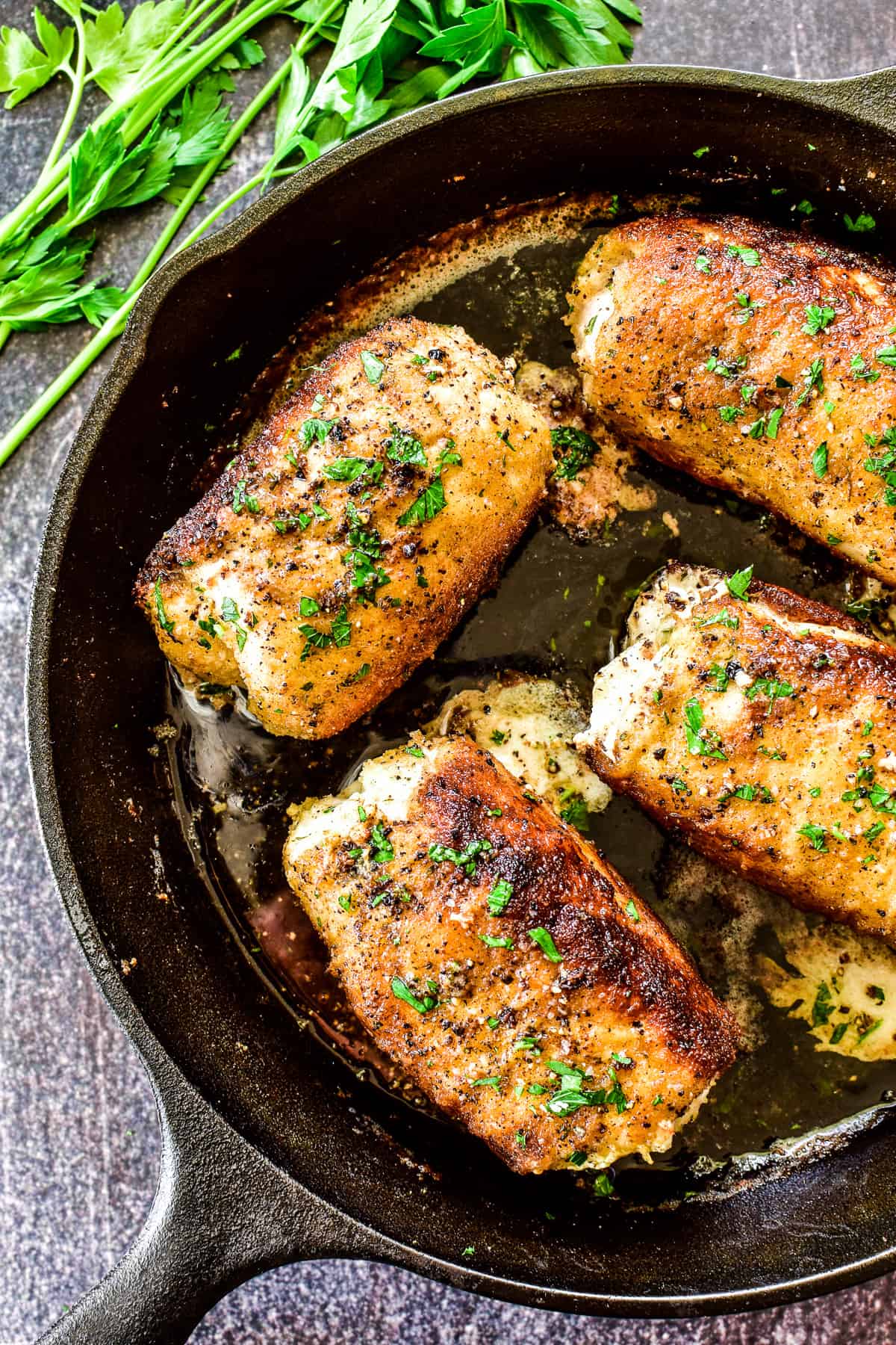 Overhead shot of Chicken Kiev in cast iron skillet