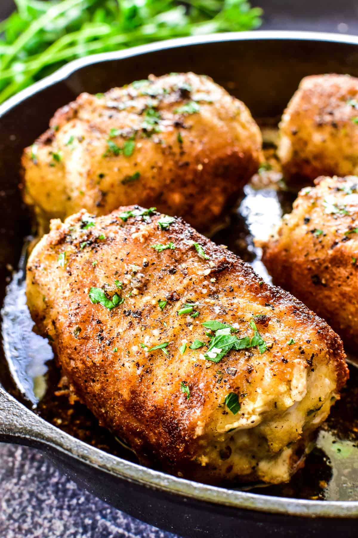 Close up of Chicken Kiev in cast iron skillet
