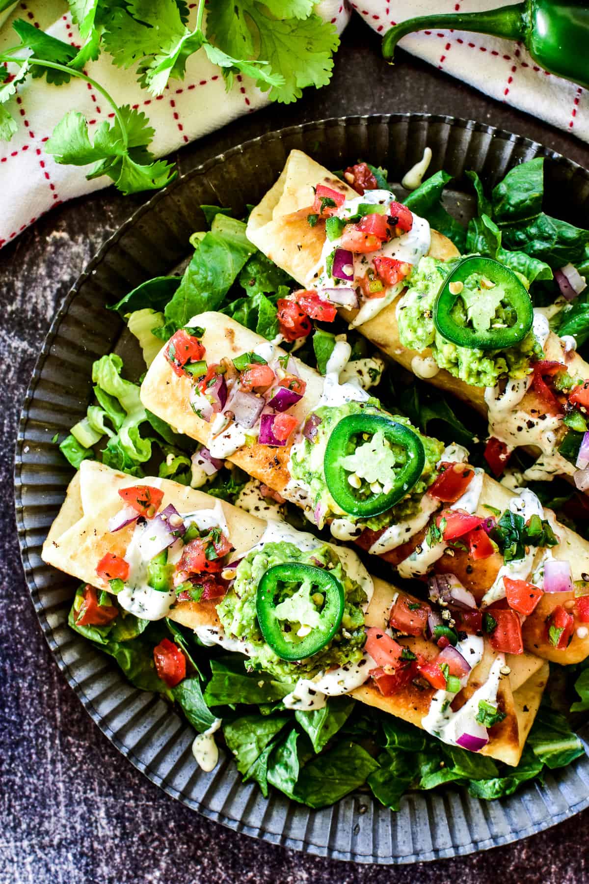 Overhead shot of Chicken Flautas with toppings