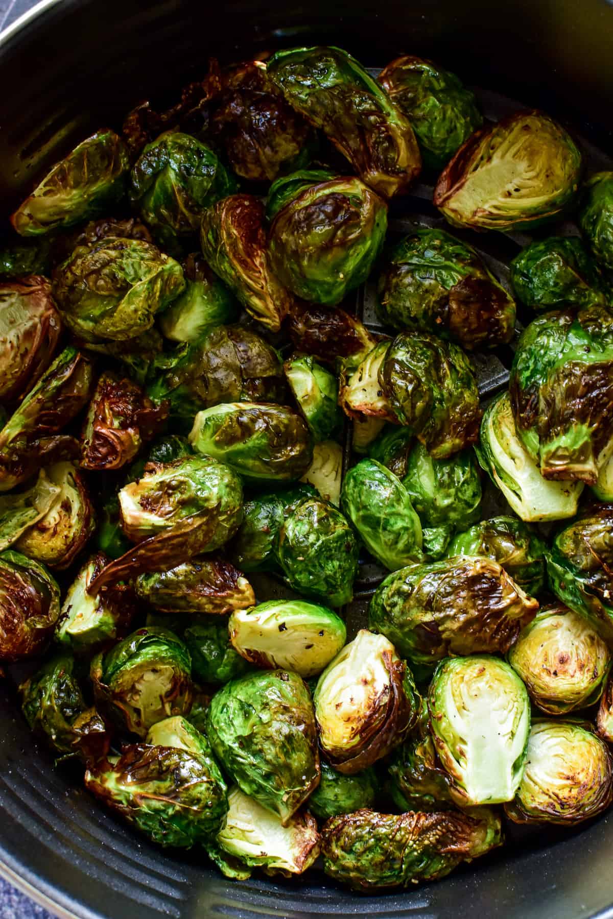 Brussels Sprouts in an air fryer basket