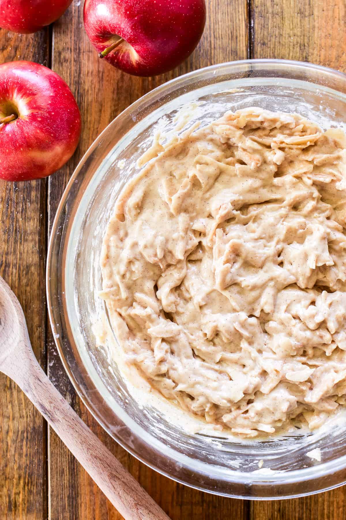 Apple Cake batter in a glass mixing bowl