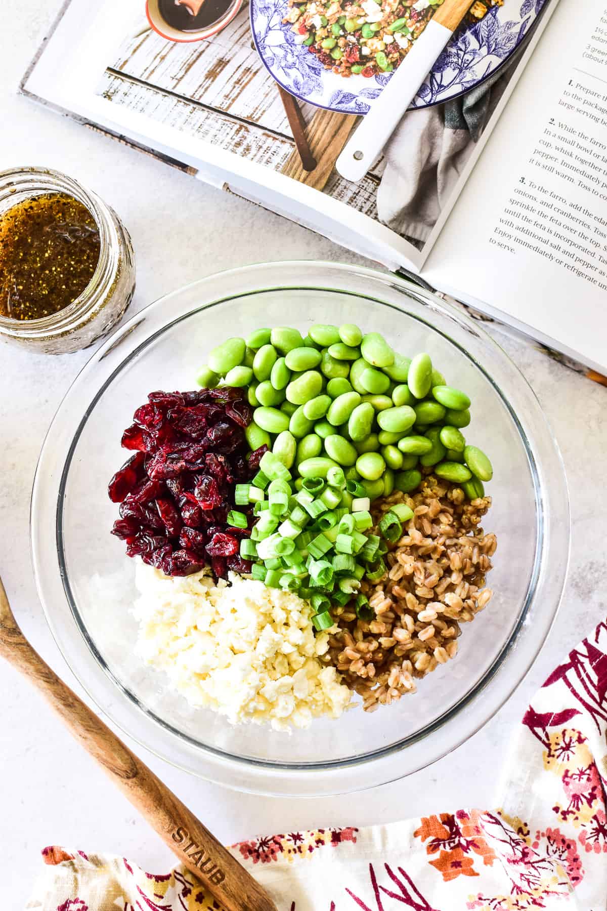 Overhead shot of Farro Salad ingredients combined in mixing bowl