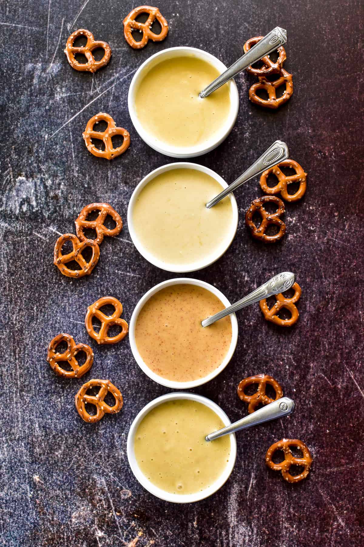 Overhead shot of Honey Mustard 4 ways in separate white bowls