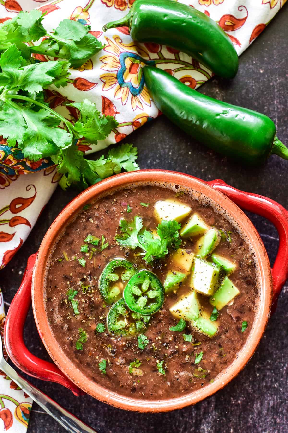 Overhead shot of Black Bean Soup with garnishes