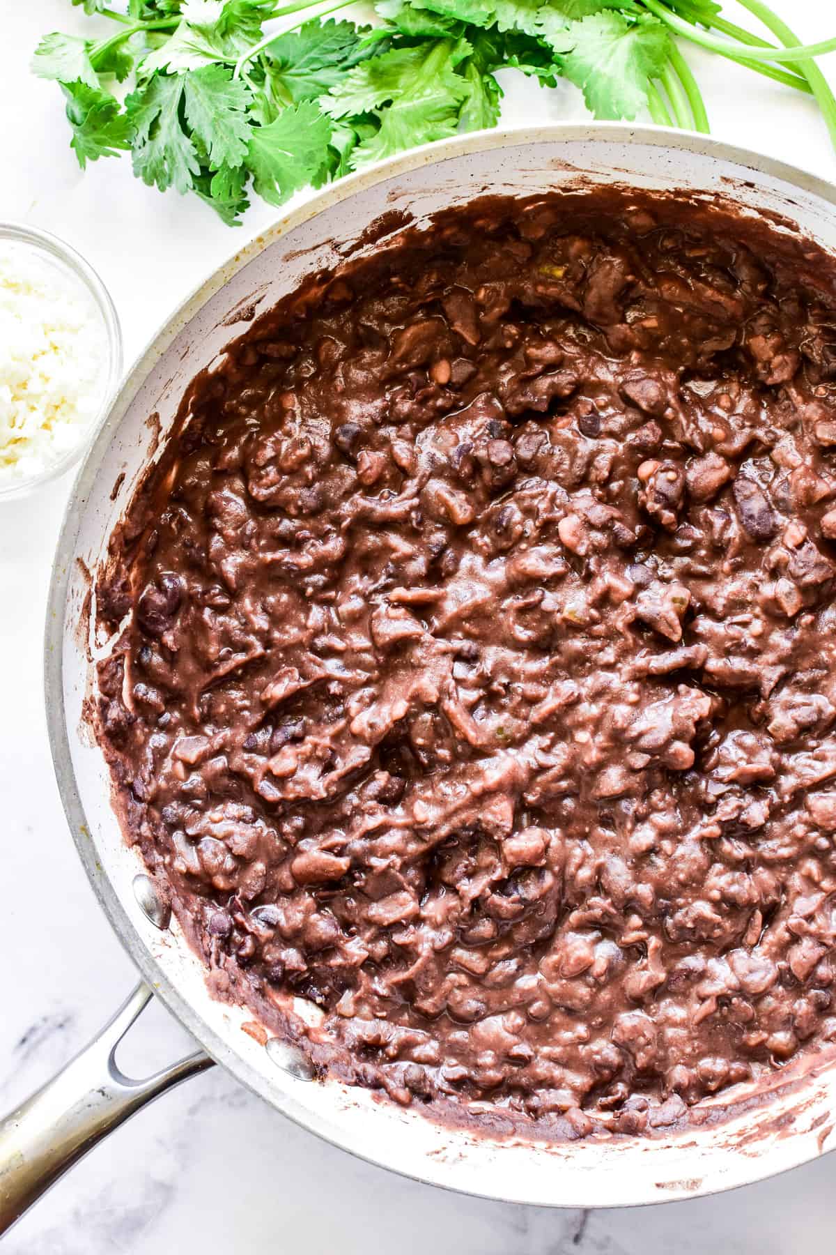 Refried Black Beans in skillet without garnish