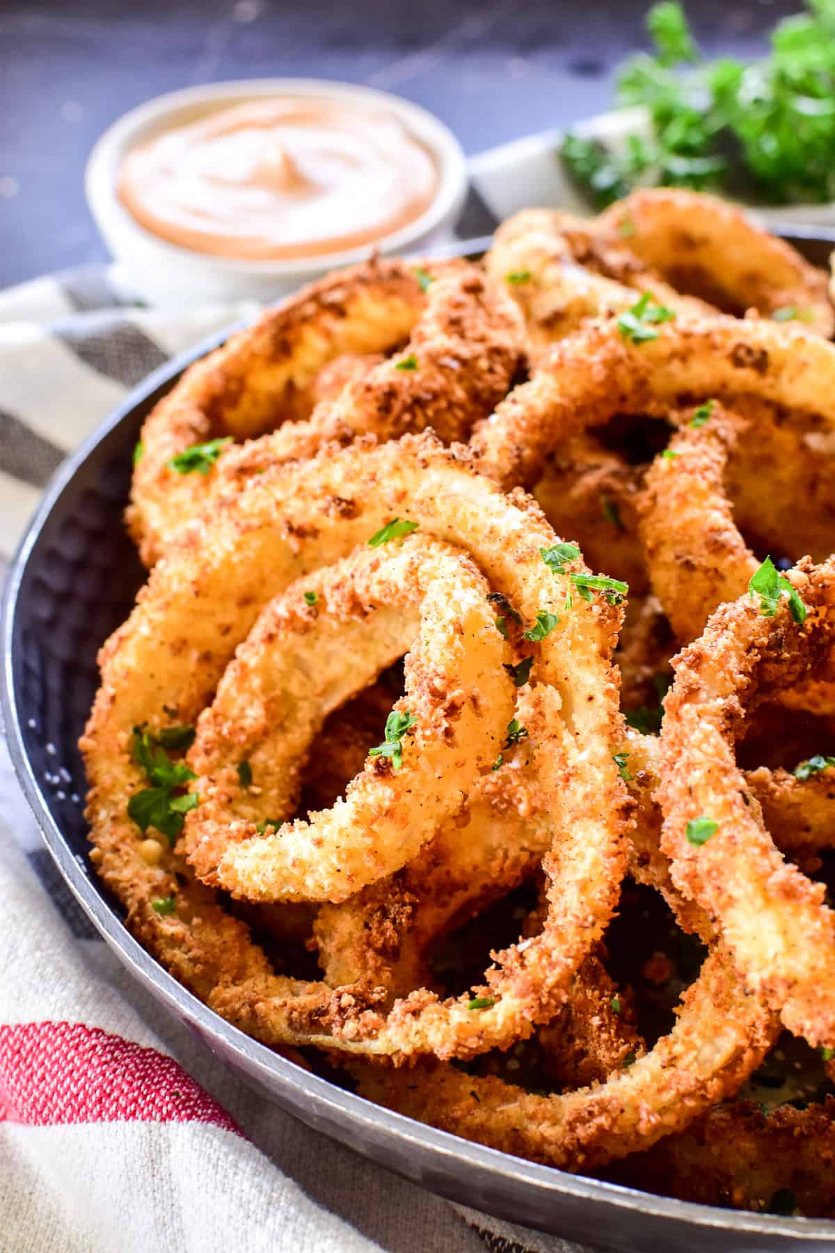 Close up of Air Fryer Onion Rings with dipping sauce