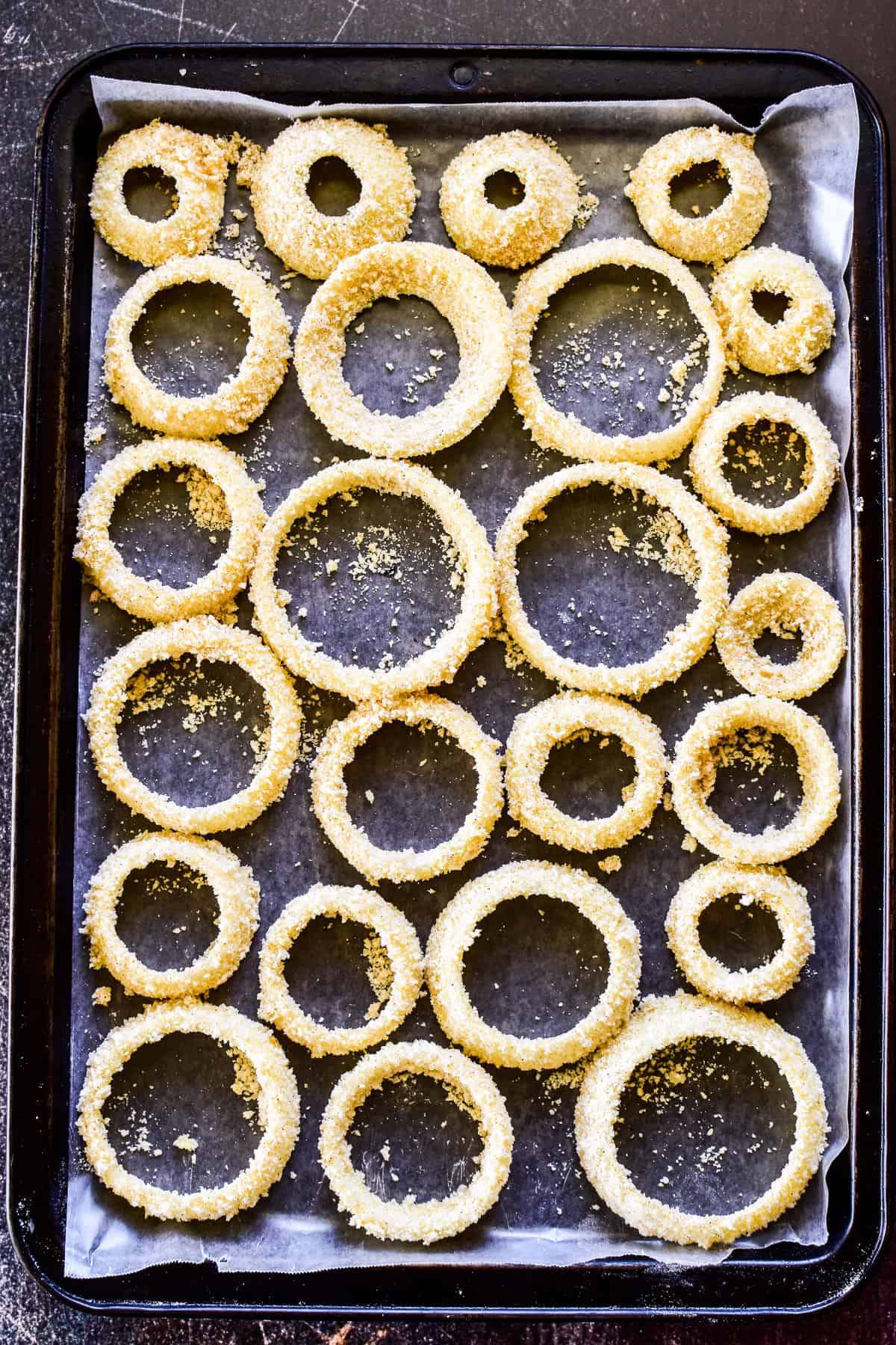 Breaded onion rings before frying