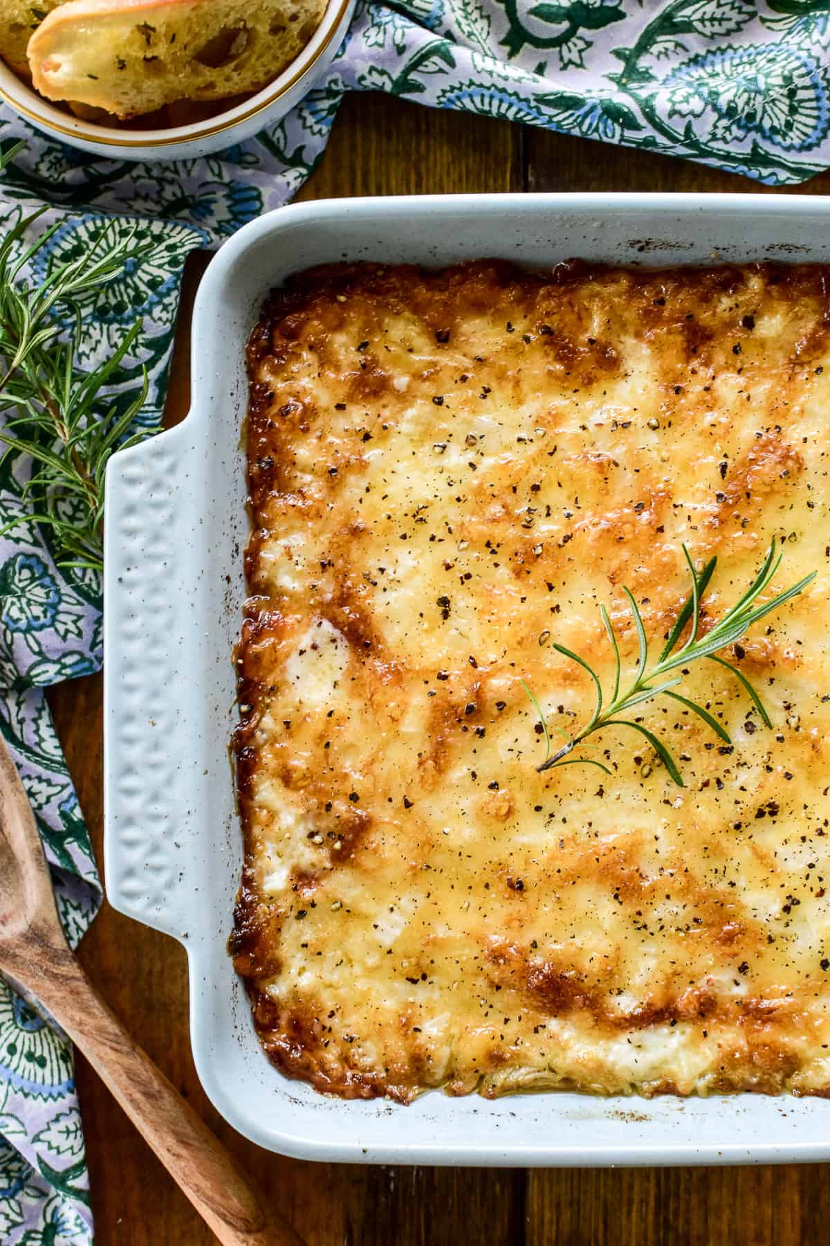 Overhead shot of baked Vidalia Onion Dip in a light blue baking pan