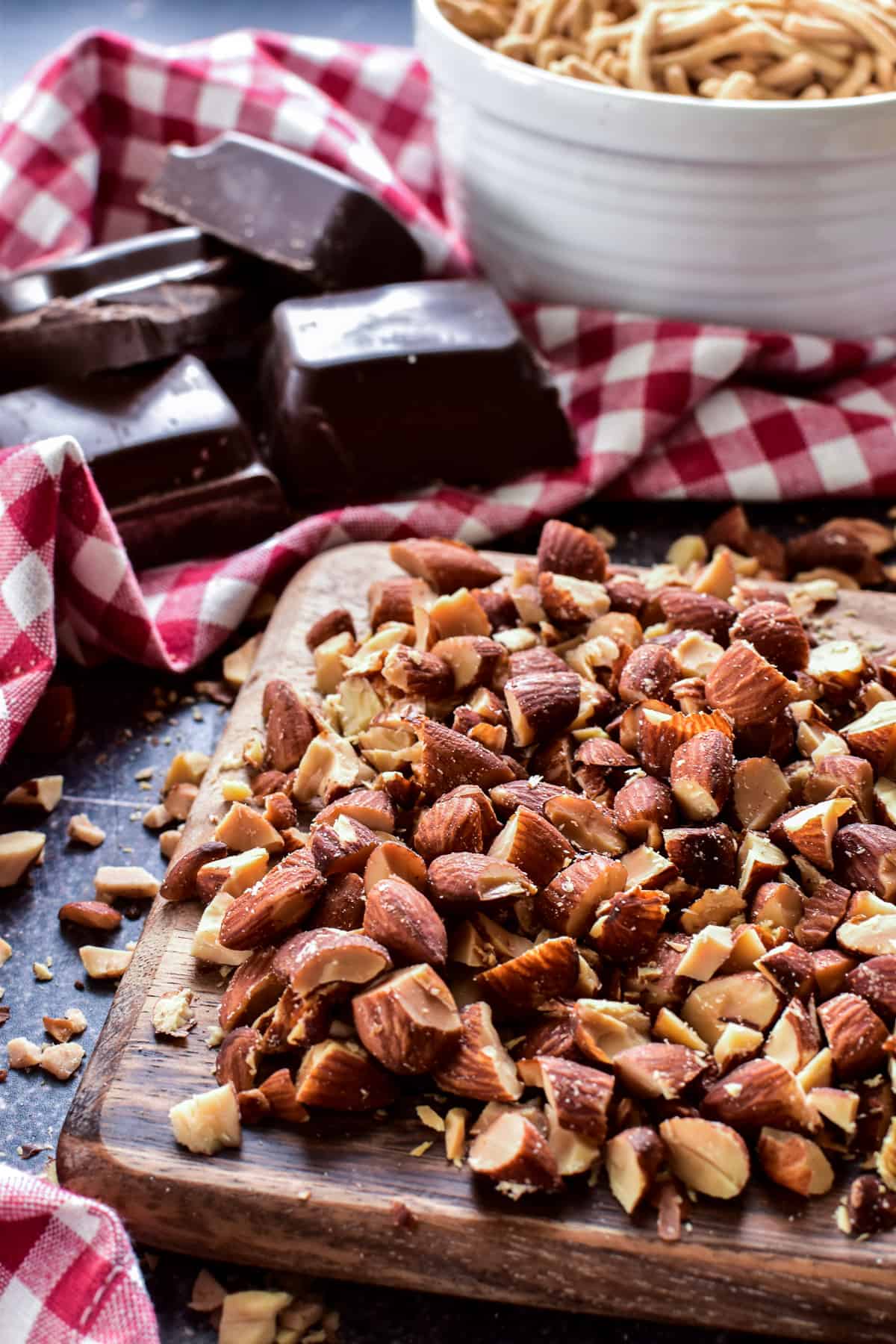 Chopped almonds on a wooden cutting board