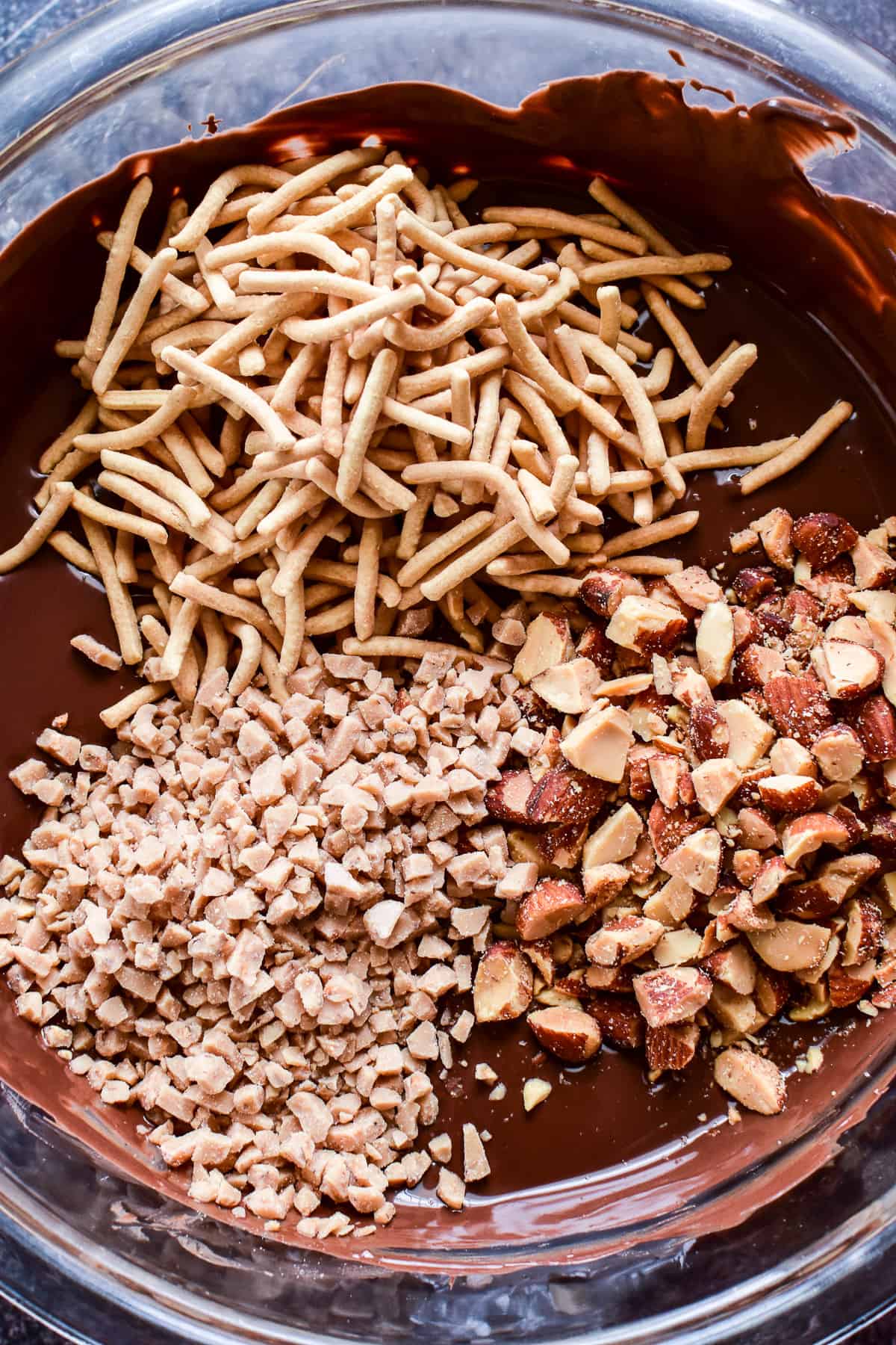 Ingredients for English Toffee Haystacks in a glass mixing bowl