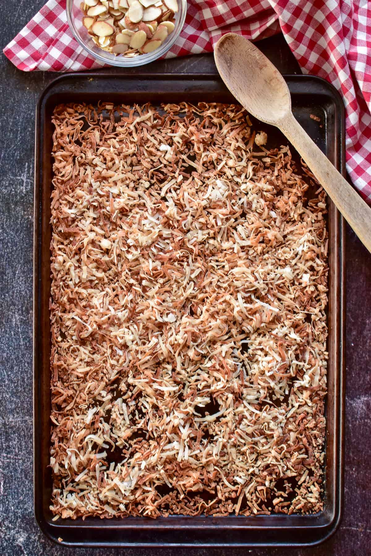 Overhead shot of toasted coconut on a baking pan