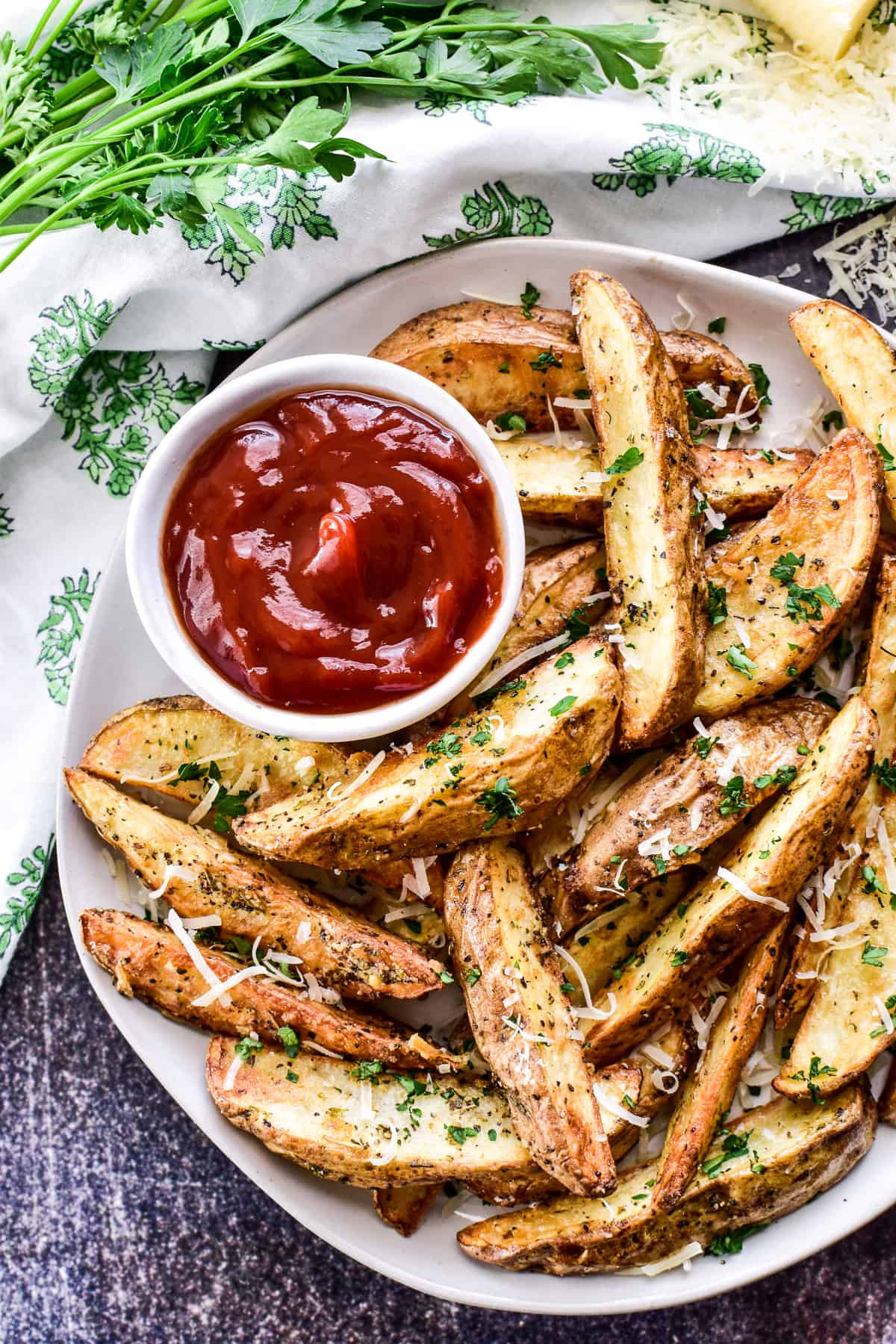 Overhead shot of Air Fryer Potato Wedges on a plate with ketchup