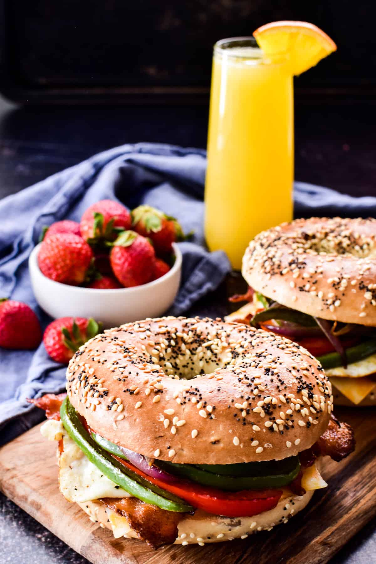 Breakfast Sandwiches with strawberries and a mimosa