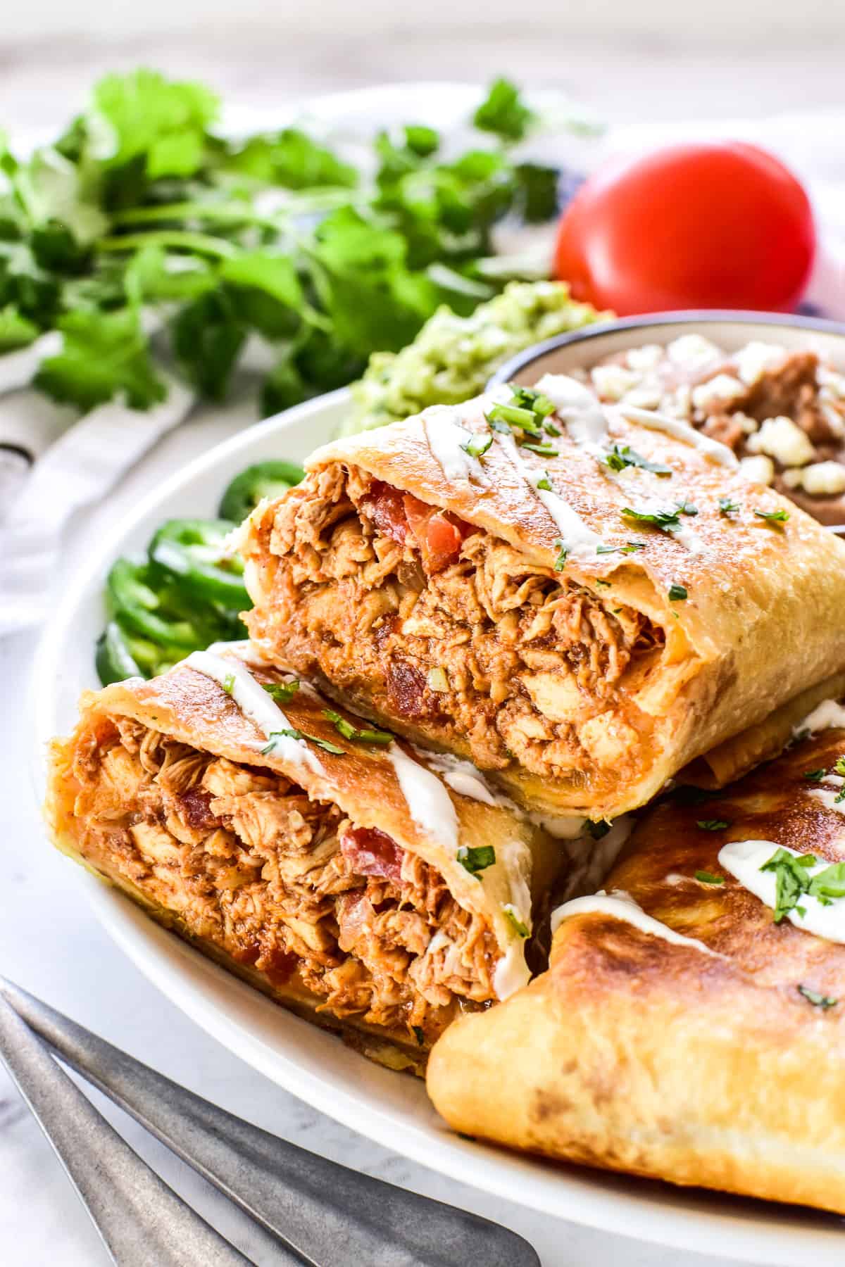 Chicken Chimichanga cut in half to show the inside