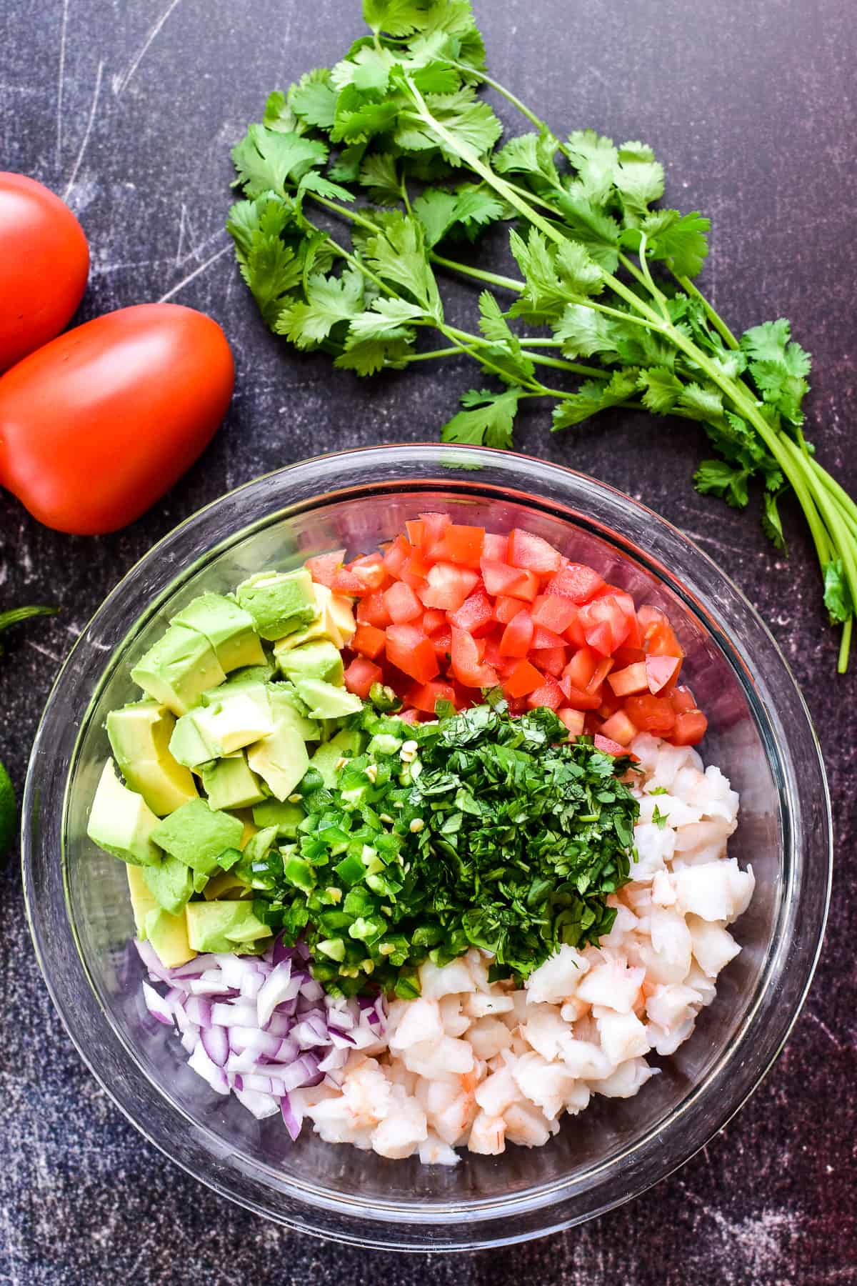 Shrimp Ceviche ingredients chopped and separated in a mixing bowl