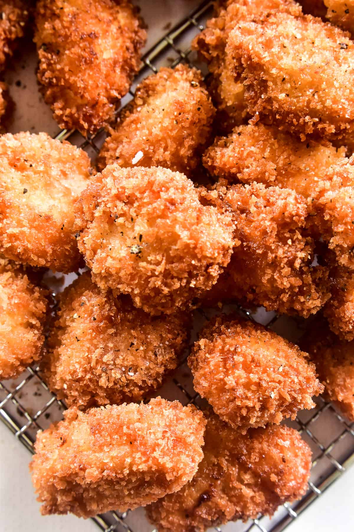 Close up of Crispy Chicken Nuggets on a wire rack