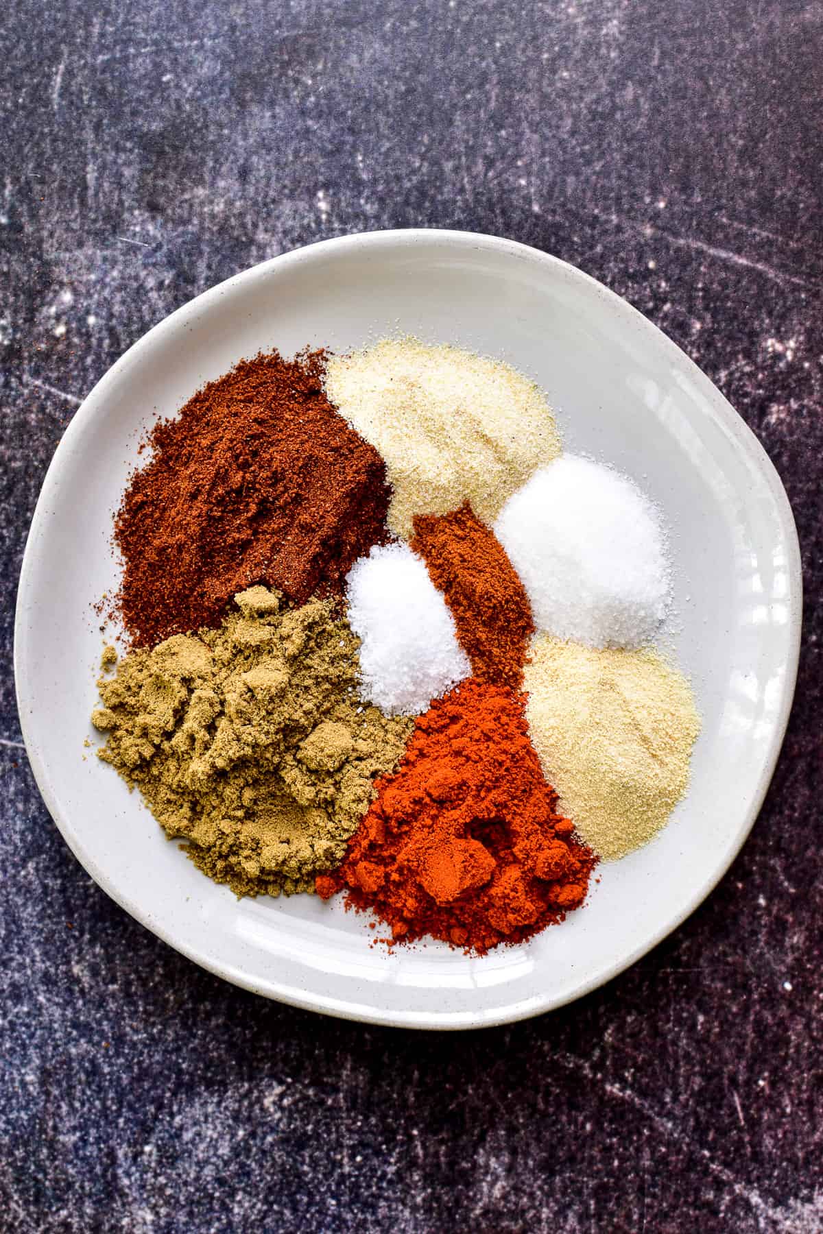 Overhead photo of Fajita Seasoning spices on a white plate