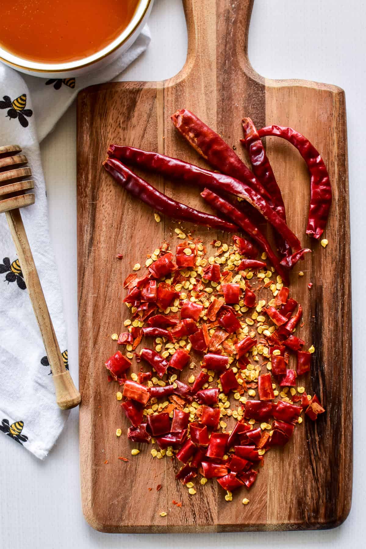 Chopped chili peppers on a wooden cutting board